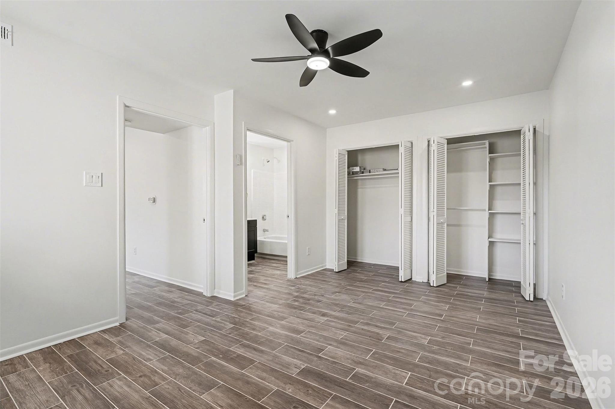 6148 Heath Ridge Court Charlotte, NC 28210 - Photo 21 of 27 a view of empty room with wooden floor