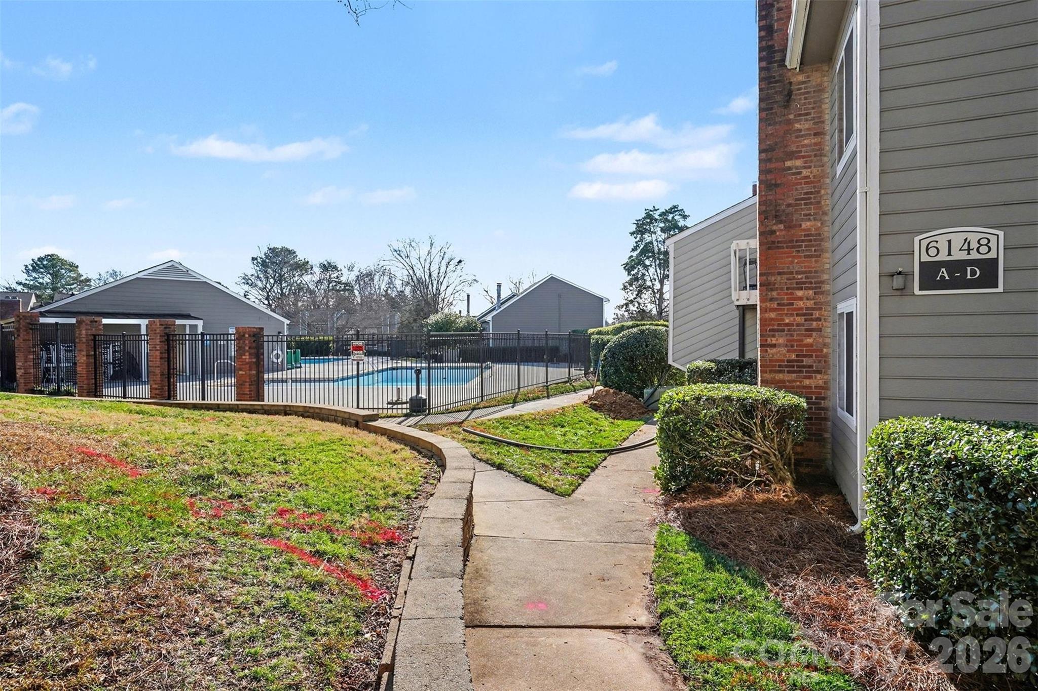 6148 Heath Ridge Court Charlotte, NC 28210 - Photo 27 of 27 a house with green field in front of it