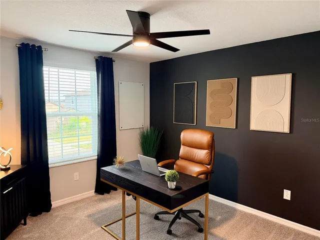 a workspace with furniture and a window