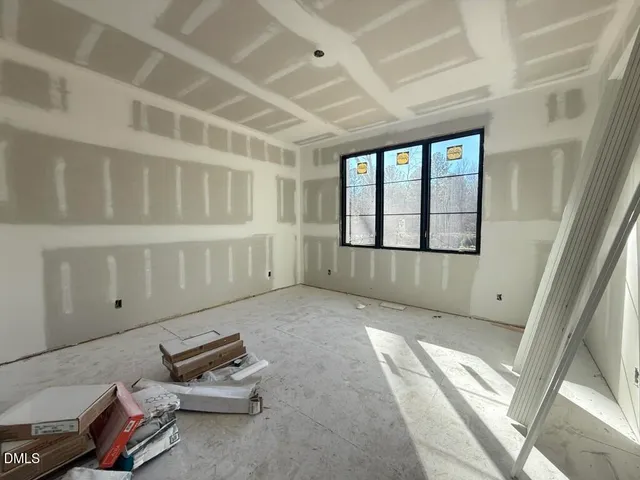 a view of a livingroom with furniture and windows