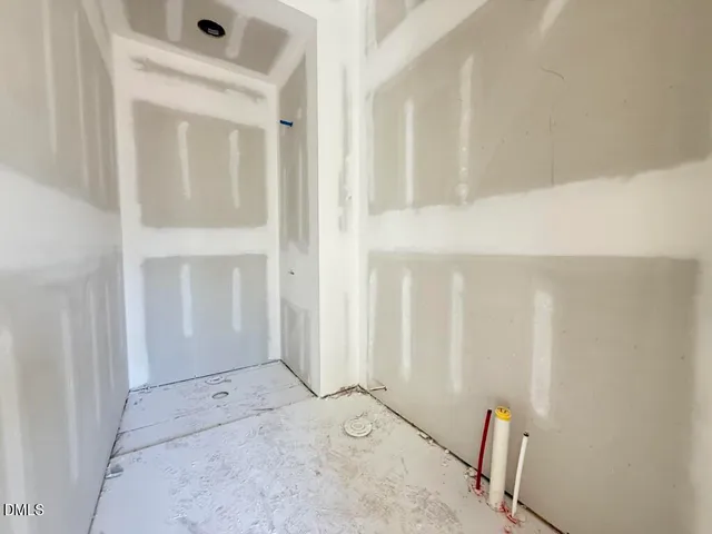 a bathroom with a tub and shower