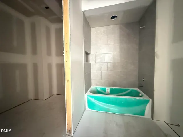 a view of a dining room with furniture wooden floor and chandelier