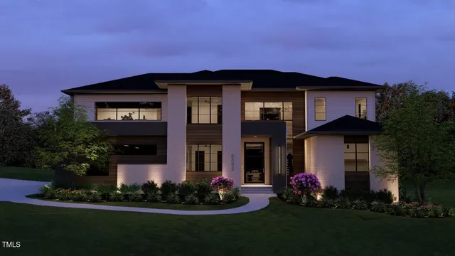 a front view of a house with a garden