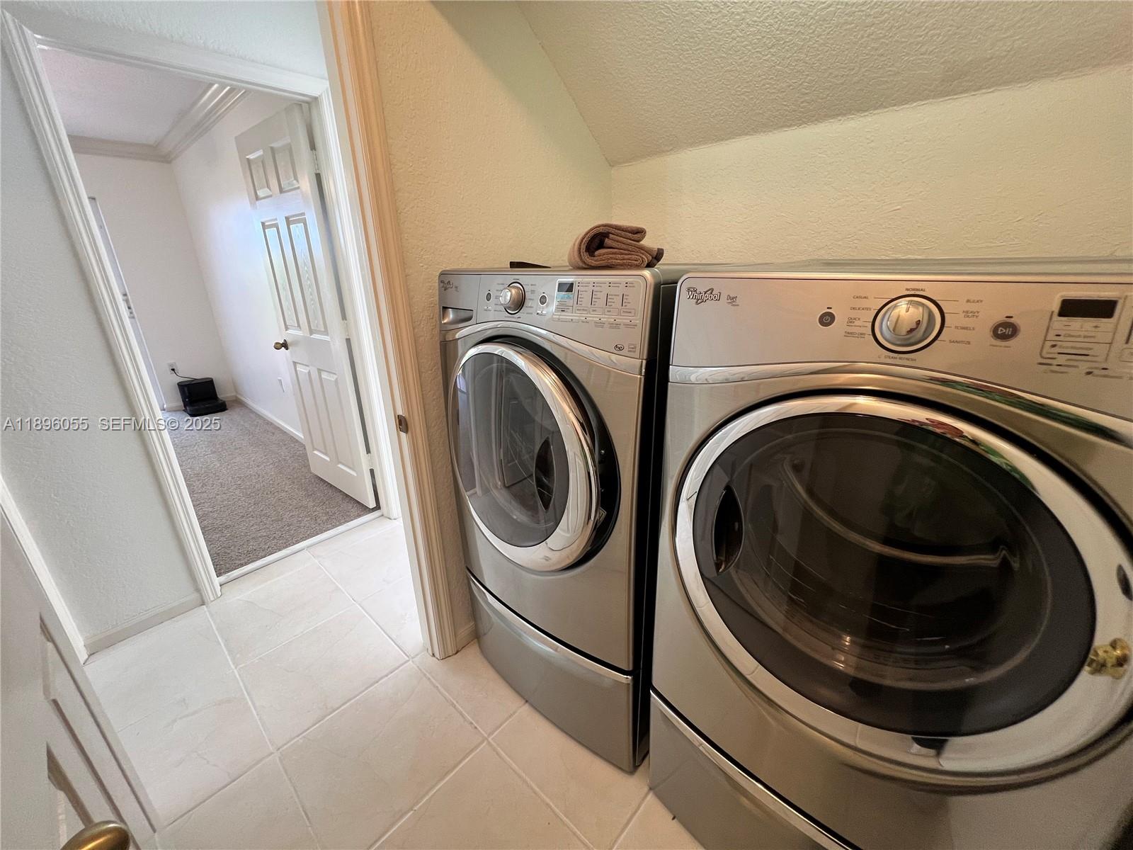 12247 Southwest 140th Street Miami, FL 33186 - Photo 37 of 86 a utility room with dryer and washer