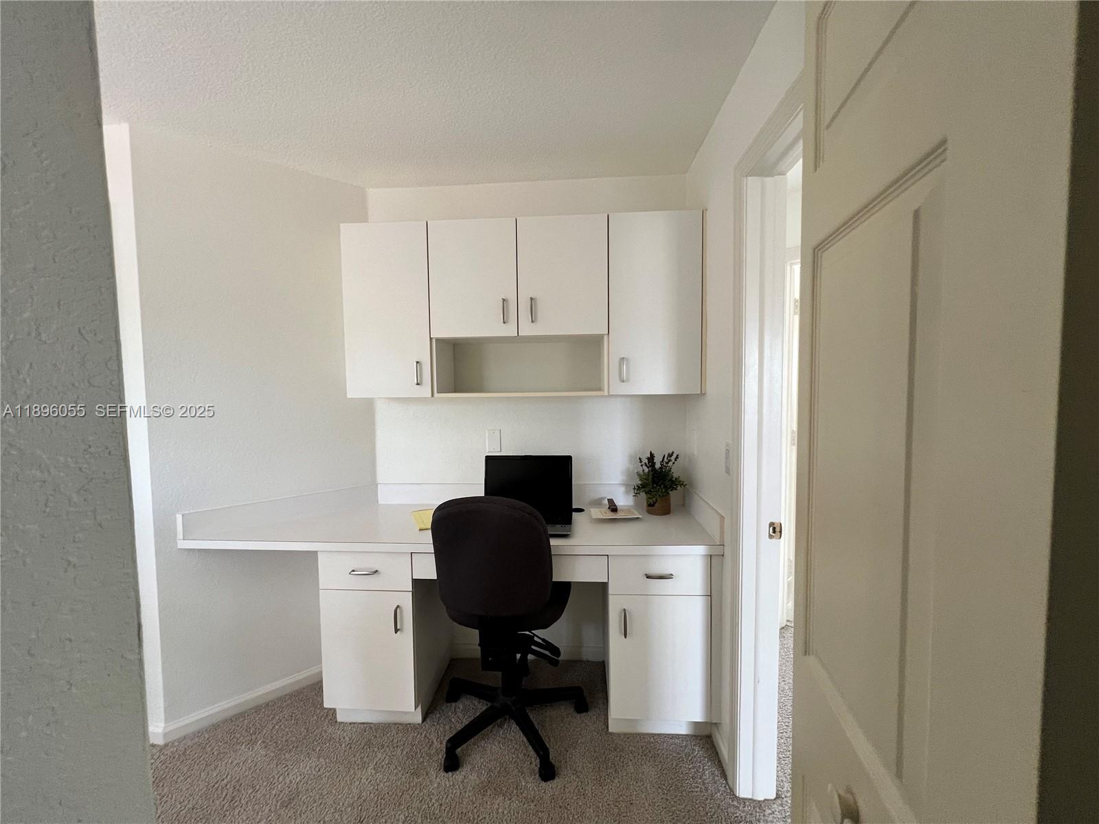 12247 Southwest 140th Street Miami, FL 33186 - Photo 59 of 86 a view of a workspace with furniture and a window