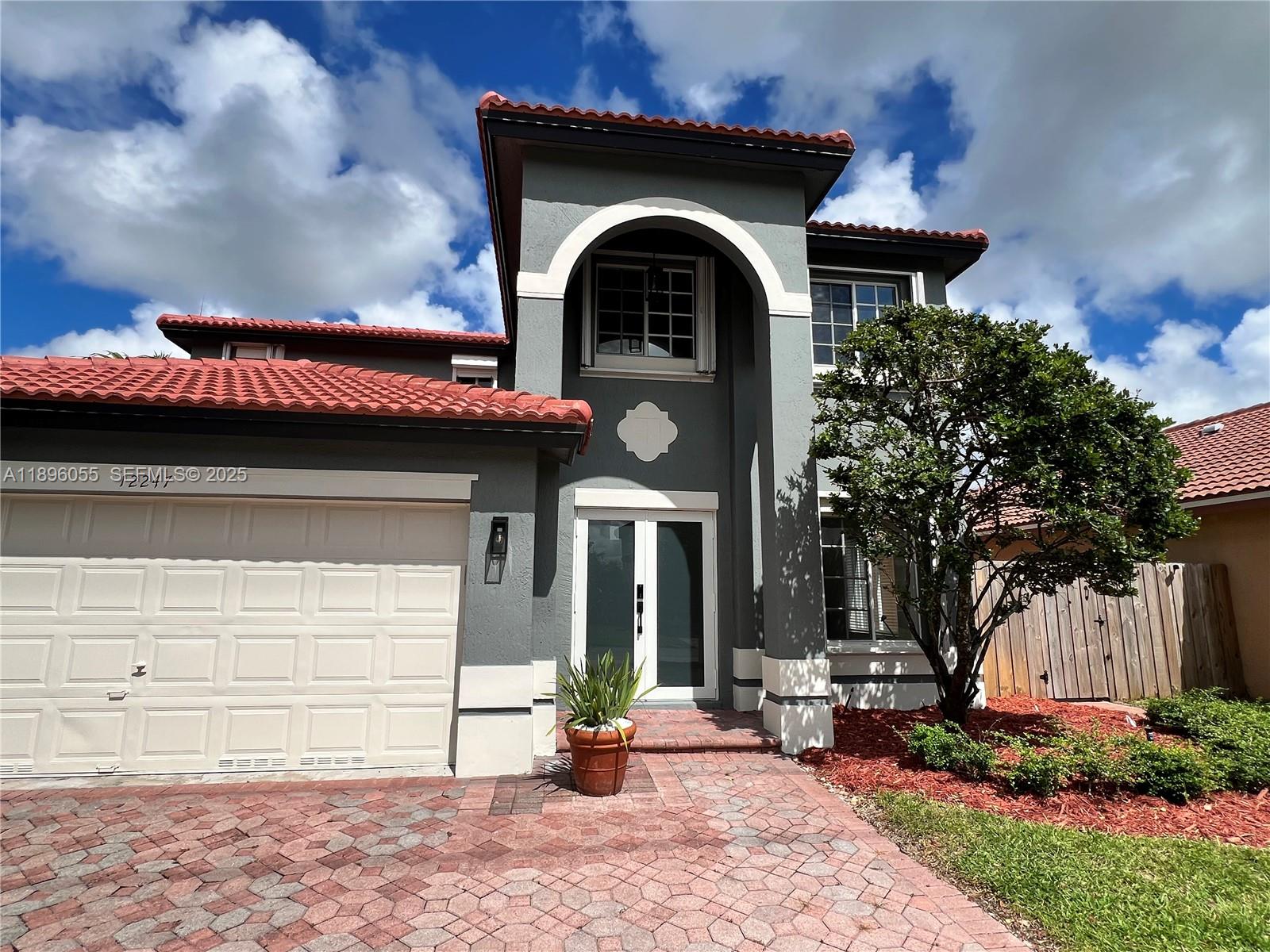 12247 Southwest 140th Street Miami, FL 33186 - Photo 72 of 86 a front view of a house with garden