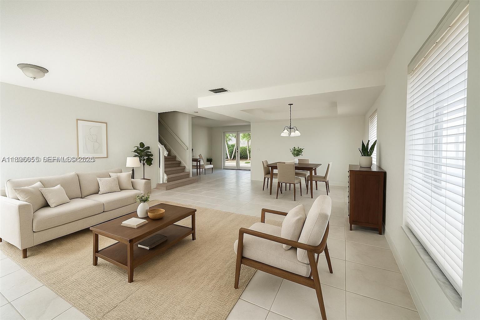 12247 Southwest 140th Street Miami, FL 33186 - Photo 81 of 86 a living room with furniture and a table