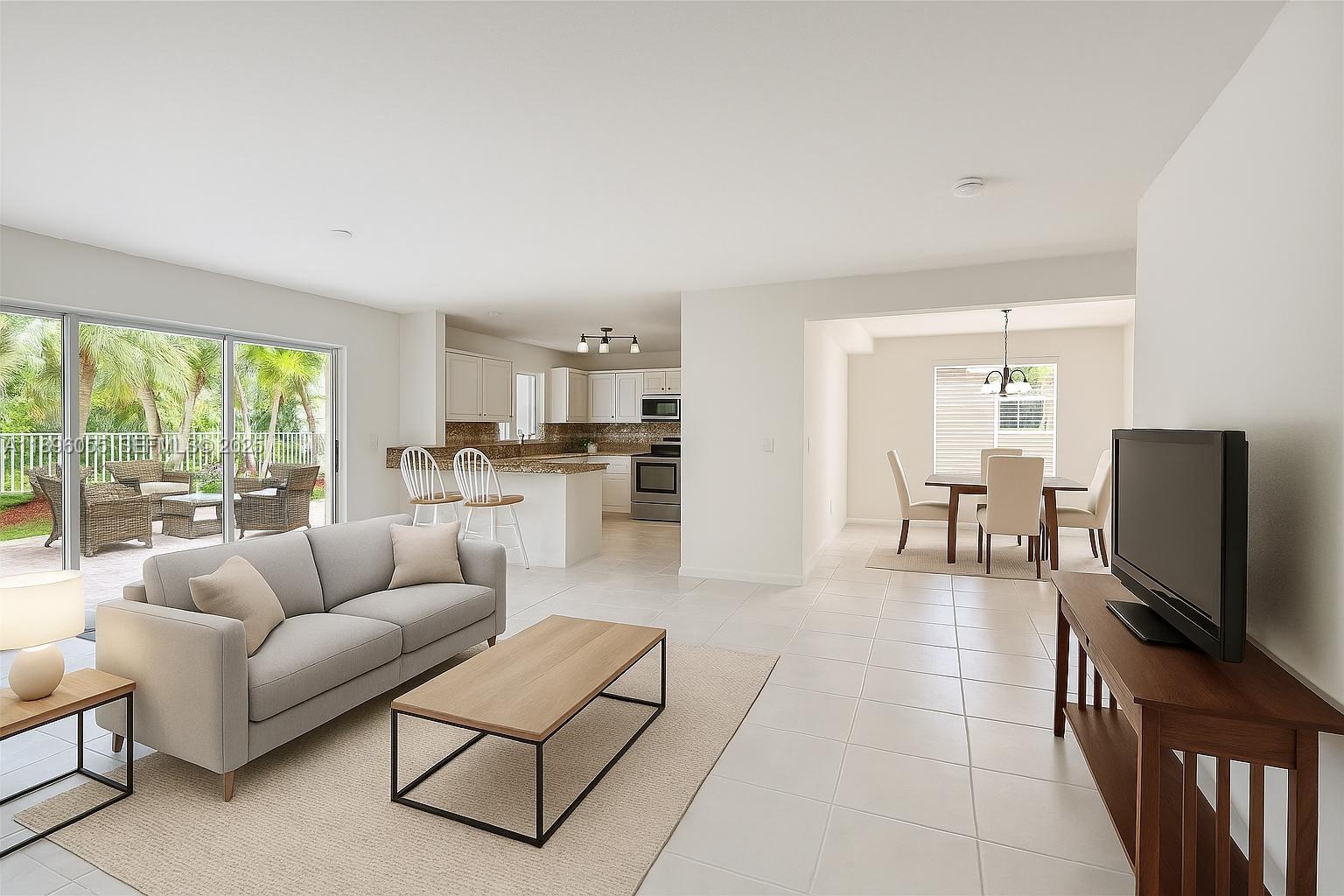 12247 Southwest 140th Street Miami, FL 33186 - Photo 82 of 86 a living room with furniture and a flat screen tv