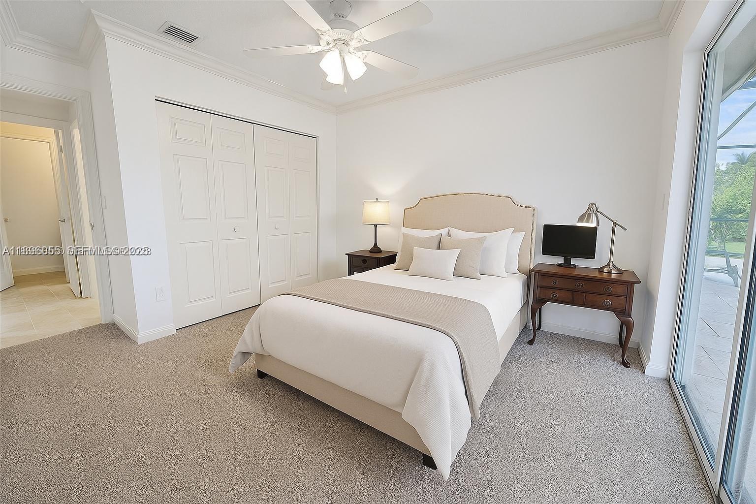 12247 Southwest 140th Street Miami, FL 33186 - Photo 86 of 86 a bedroom with a bed and a chandelier