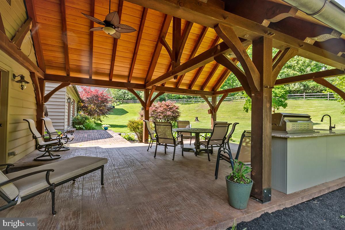 1621 Limekiln Road Oley, PA 19547 - Photo 18 of 75 a view of a patio with a table chairs and a backyard