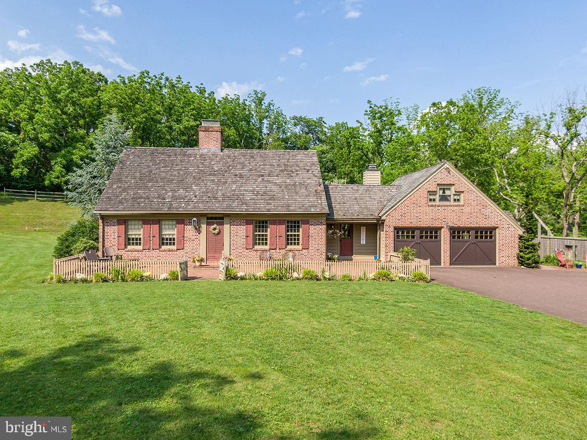 1621 Limekiln Road Oley, PA 19547 - Photo 21 of 75 a front view of a house with a garden and trees
