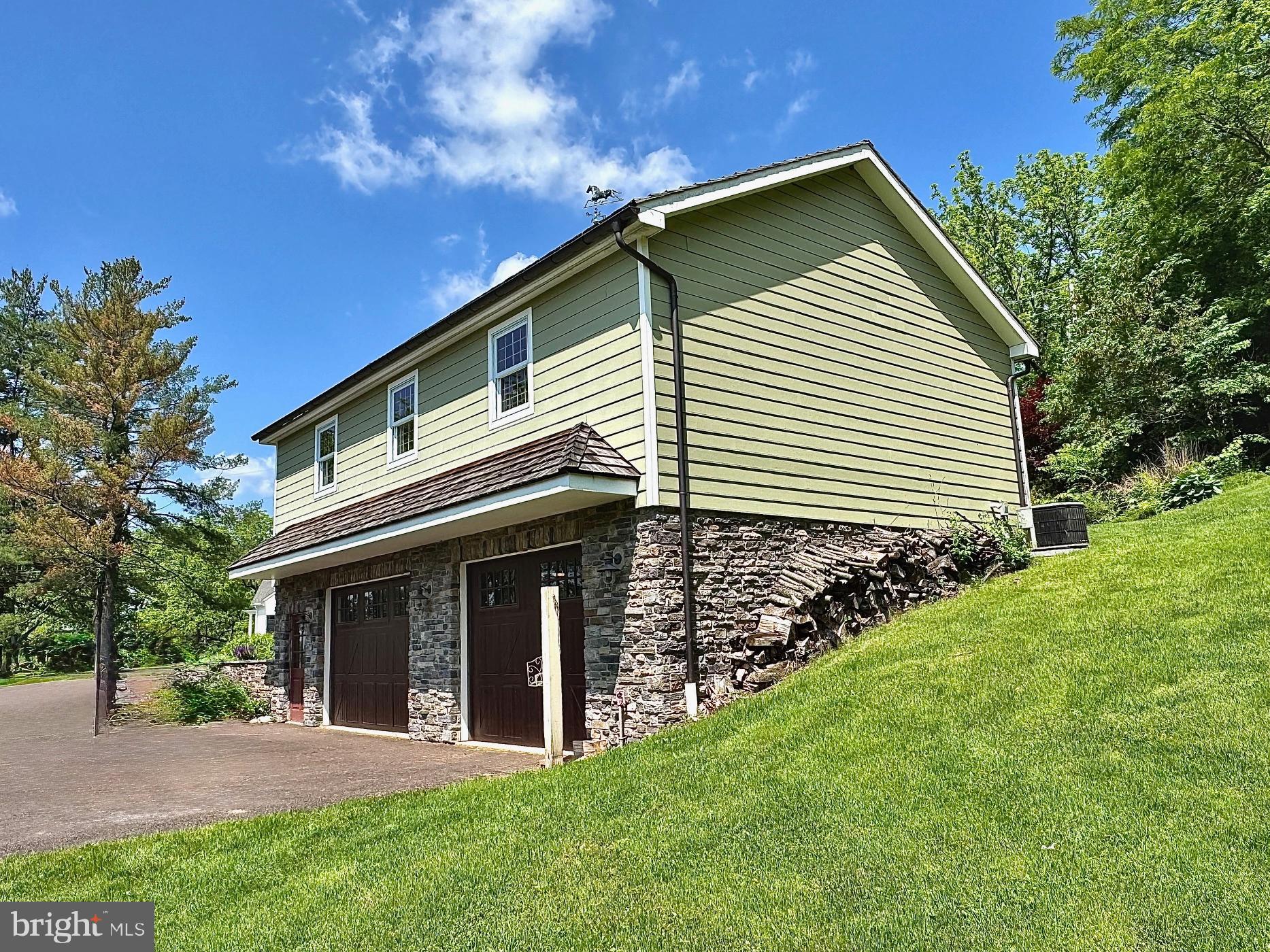 1621 Limekiln Road Oley, PA 19547 - Photo 28 of 75 a front view of a house with a garden