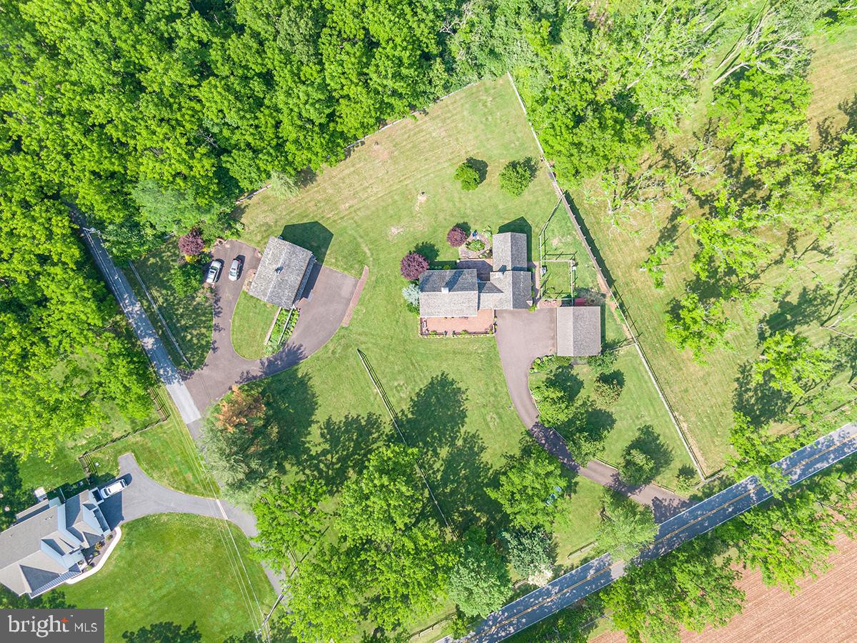 1621 Limekiln Road Oley, PA 19547 - Photo 31 of 75 an aerial view of a house with a yard and trees