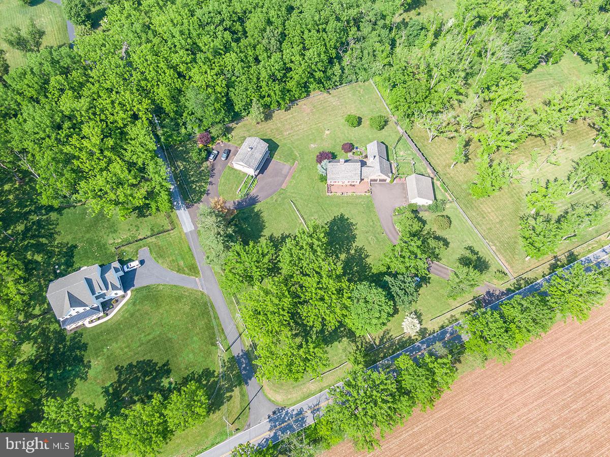 1621 Limekiln Road Oley, PA 19547 - Photo 32 of 75 an aerial view of a house with a yard and trees