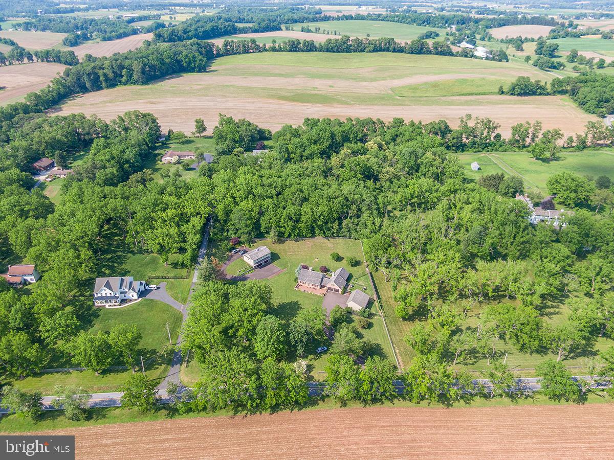 1621 Limekiln Road Oley, PA 19547 - Photo 36 of 75 an aerial view of a house with a yard and lake view