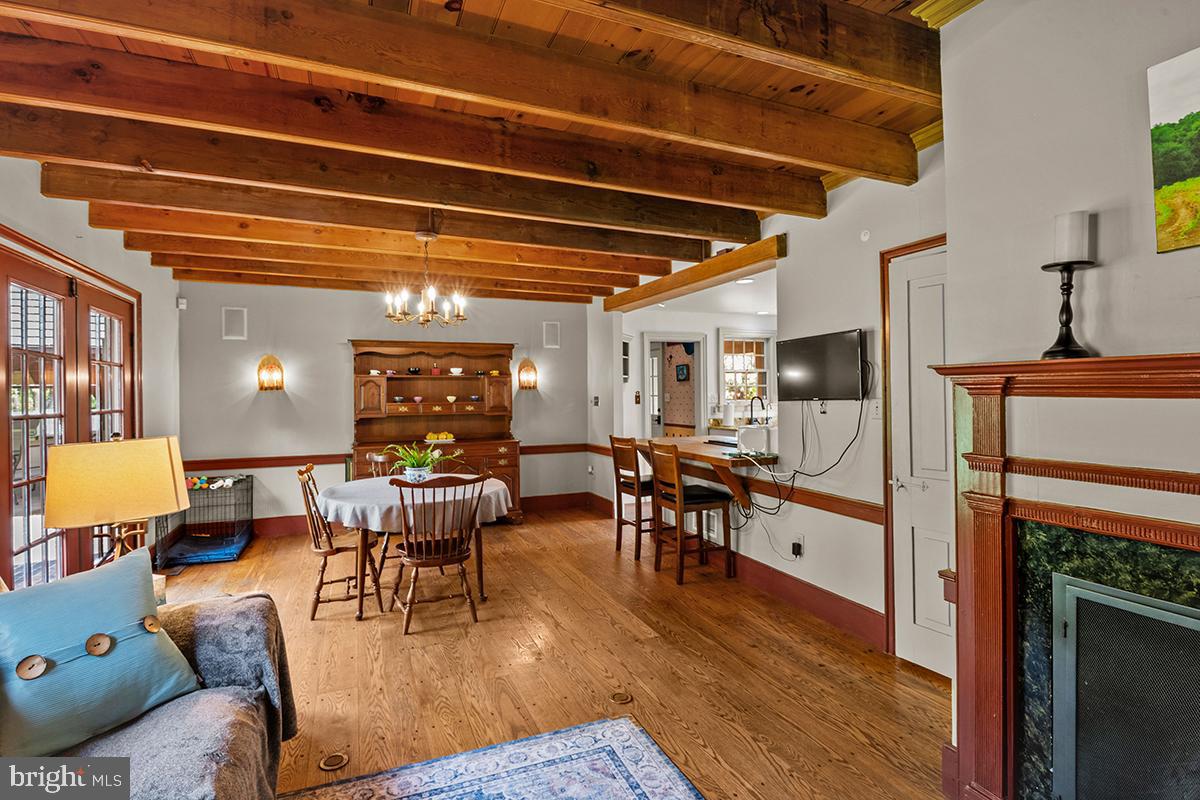 1621 Limekiln Road Oley, PA 19547 - Photo 41 of 75 a living room with furniture a fireplace and wooden floor