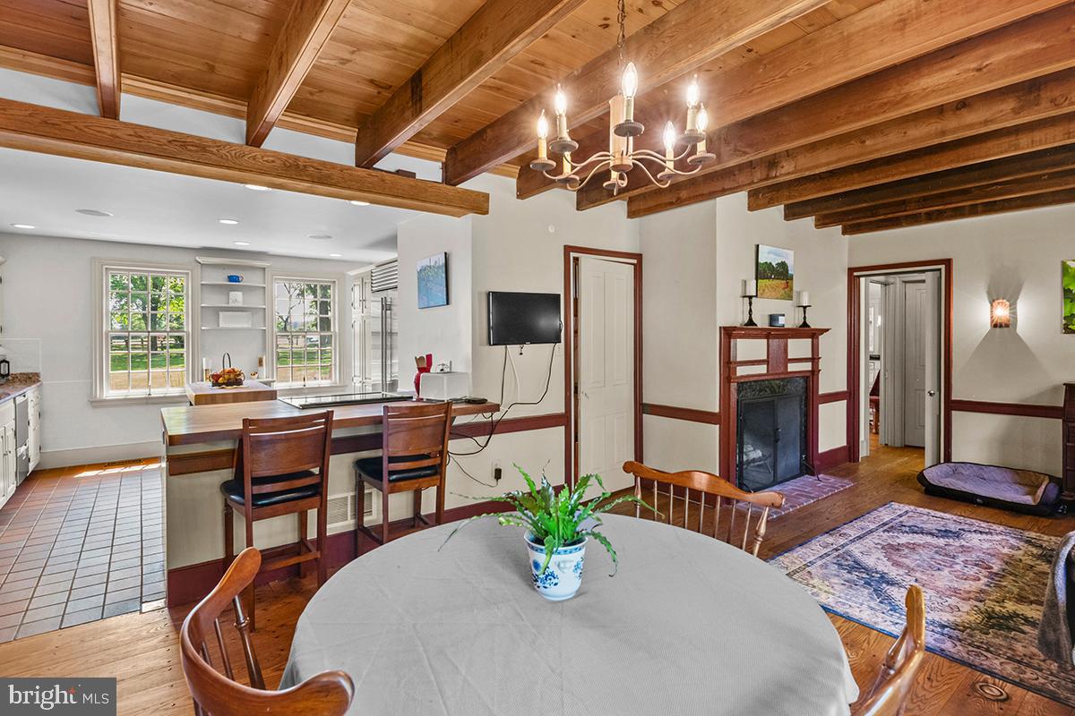 1621 Limekiln Road Oley, PA 19547 - Photo 43 of 75 a dining room with furniture a chandelier and wooden floor