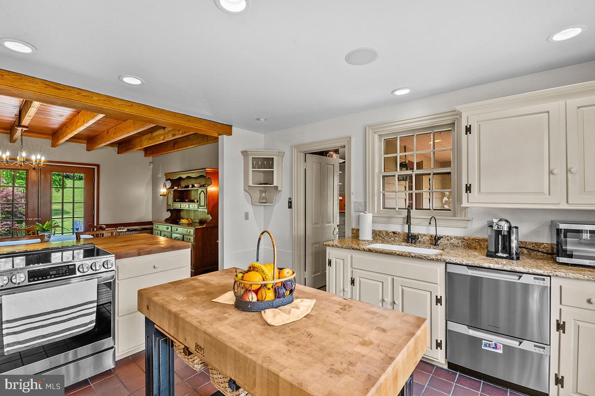 1621 Limekiln Road Oley, PA 19547 - Photo 46 of 75 a kitchen with a sink a stove and chairs