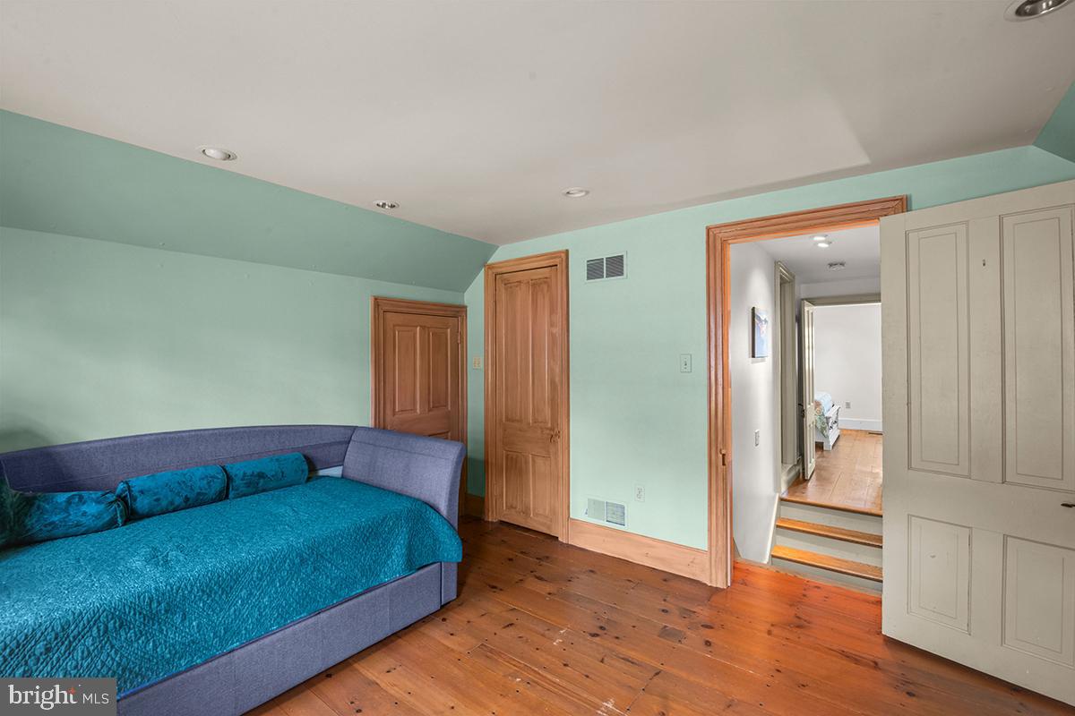 1621 Limekiln Road Oley, PA 19547 - Photo 61 of 75 a living room with a bed and a walk in closet