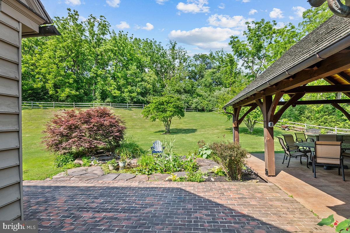 1621 Limekiln Road Oley, PA 19547 - Photo 65 of 75 a backyard of a house with outdoor seating