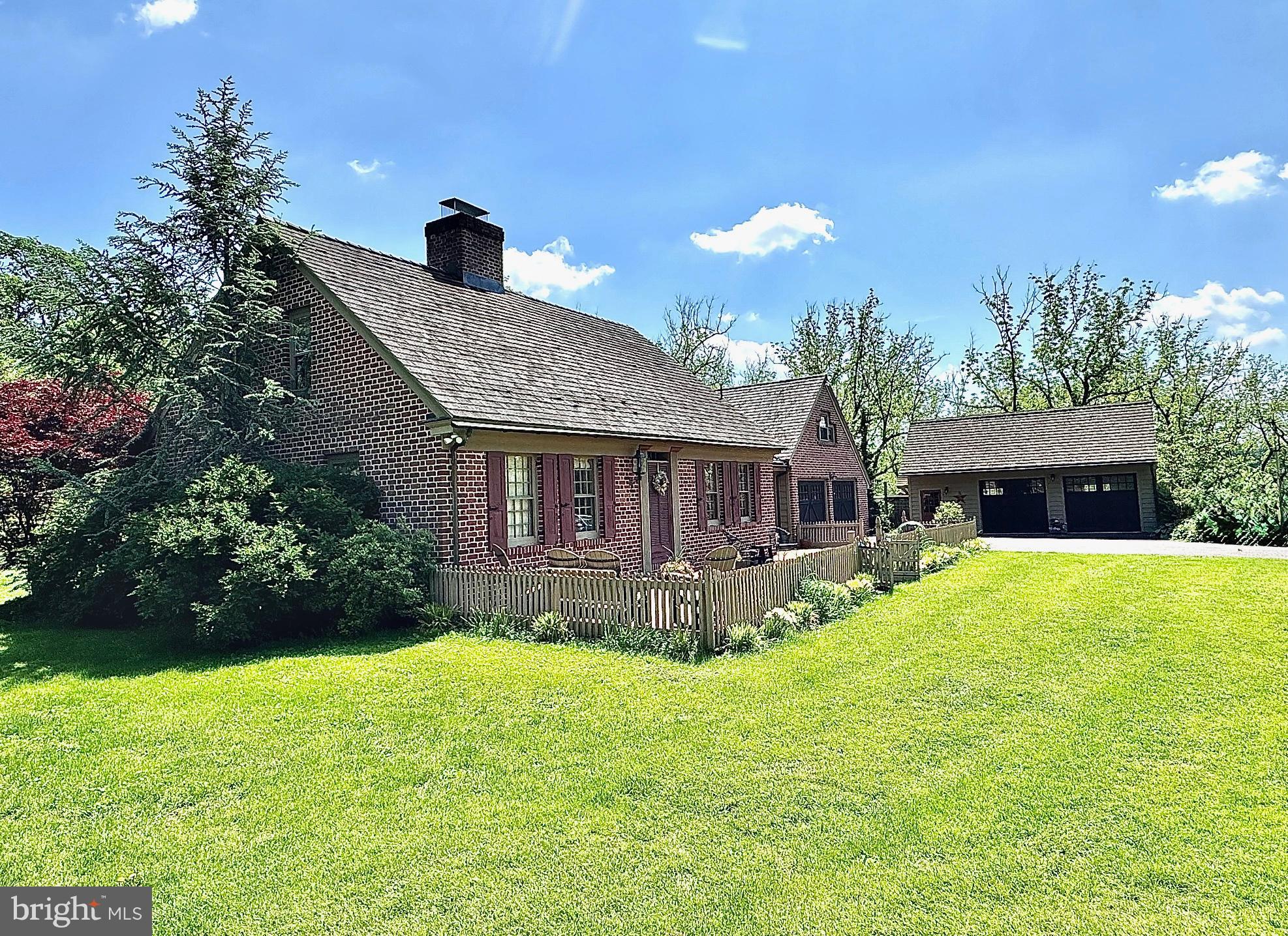 1621 Limekiln Road Oley, PA 19547 - Photo 10 of 75 a view of a house with a yard and a garden
