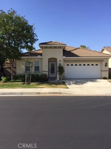 a view of house with a swimming pool