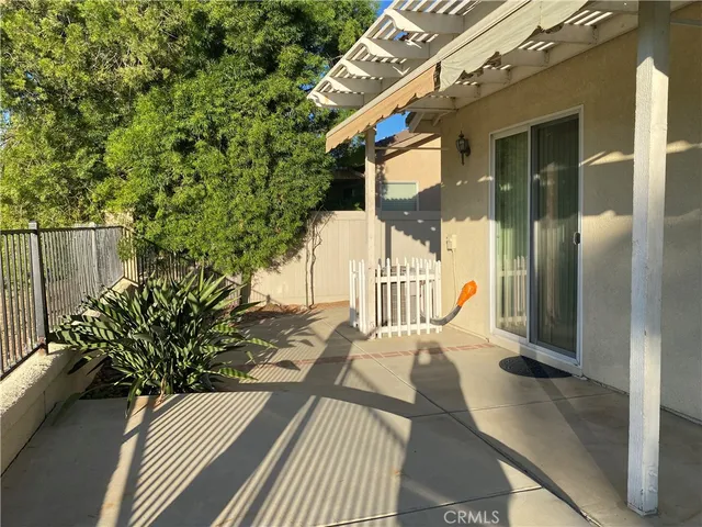 a view of a balcony with wooden floor