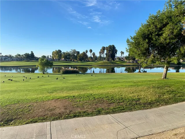 a view of a golf course with a lake