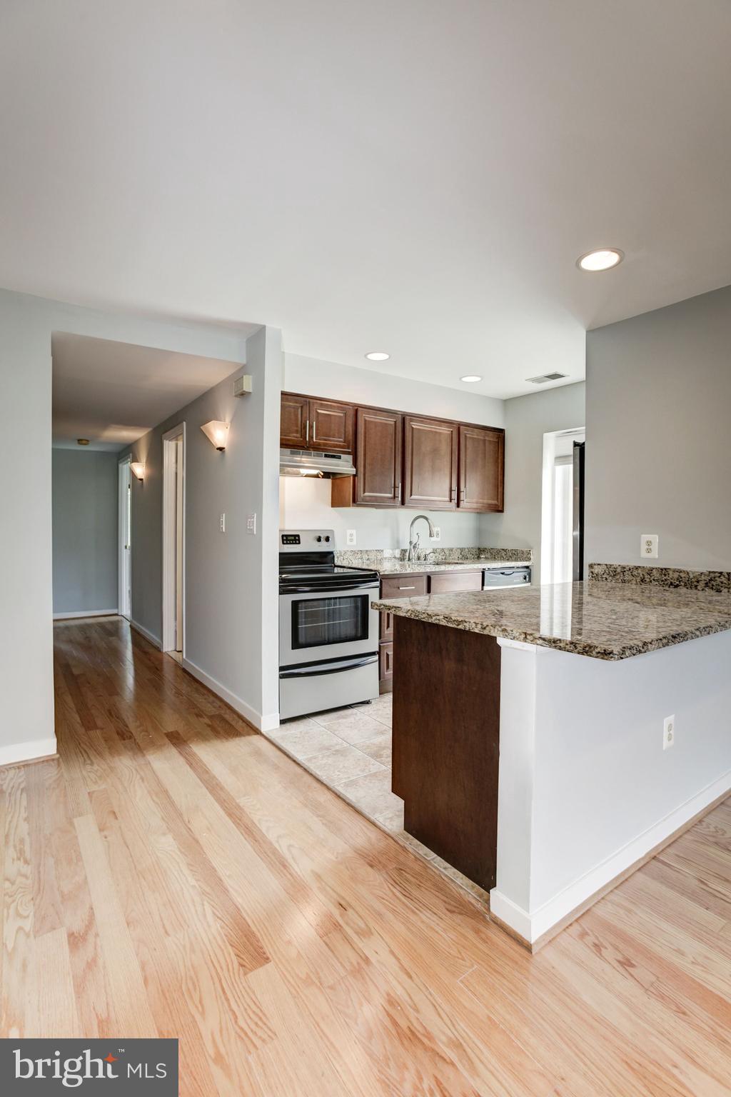 425 South Sharp Street, Unit R15 Baltimore, MD 21201 - Photo 17 of 40 Kitchen with View of Hallway to Bedrooms