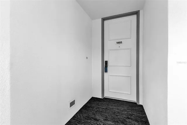 a living room filled with furniture and a large window