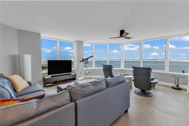 a view of a chairs and table in a balcony