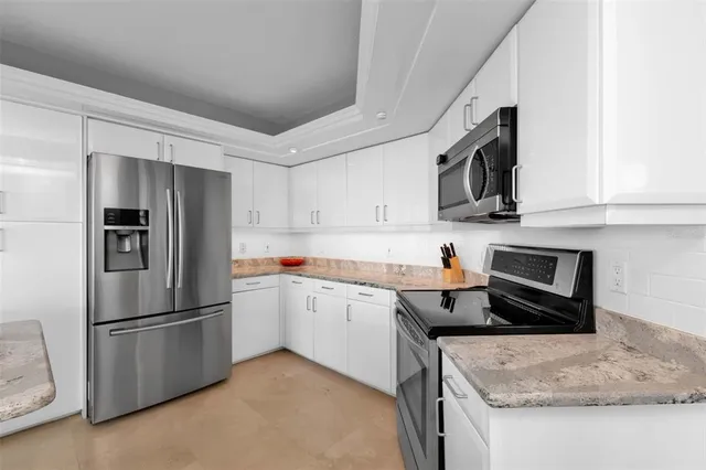 a spacious bathroom with a double vanity sink and a mirror