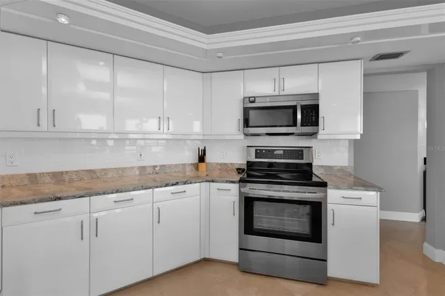 a bathroom with a sink a vanity and a mirror