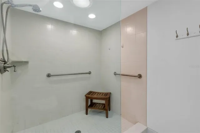 a view of a patio with a table and chairs under an umbrella