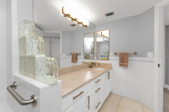 a view of swimming pool with outdoor seating and plants