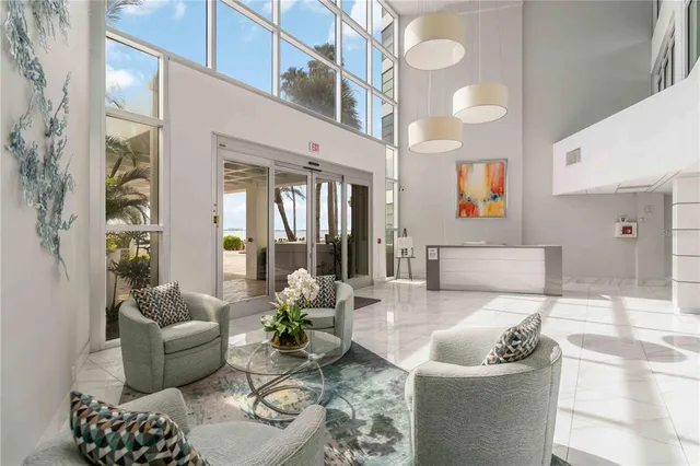 a view of a swimming pool with outdoor seating