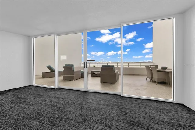 a view of a dining room with furniture a chandelier and wooden floor