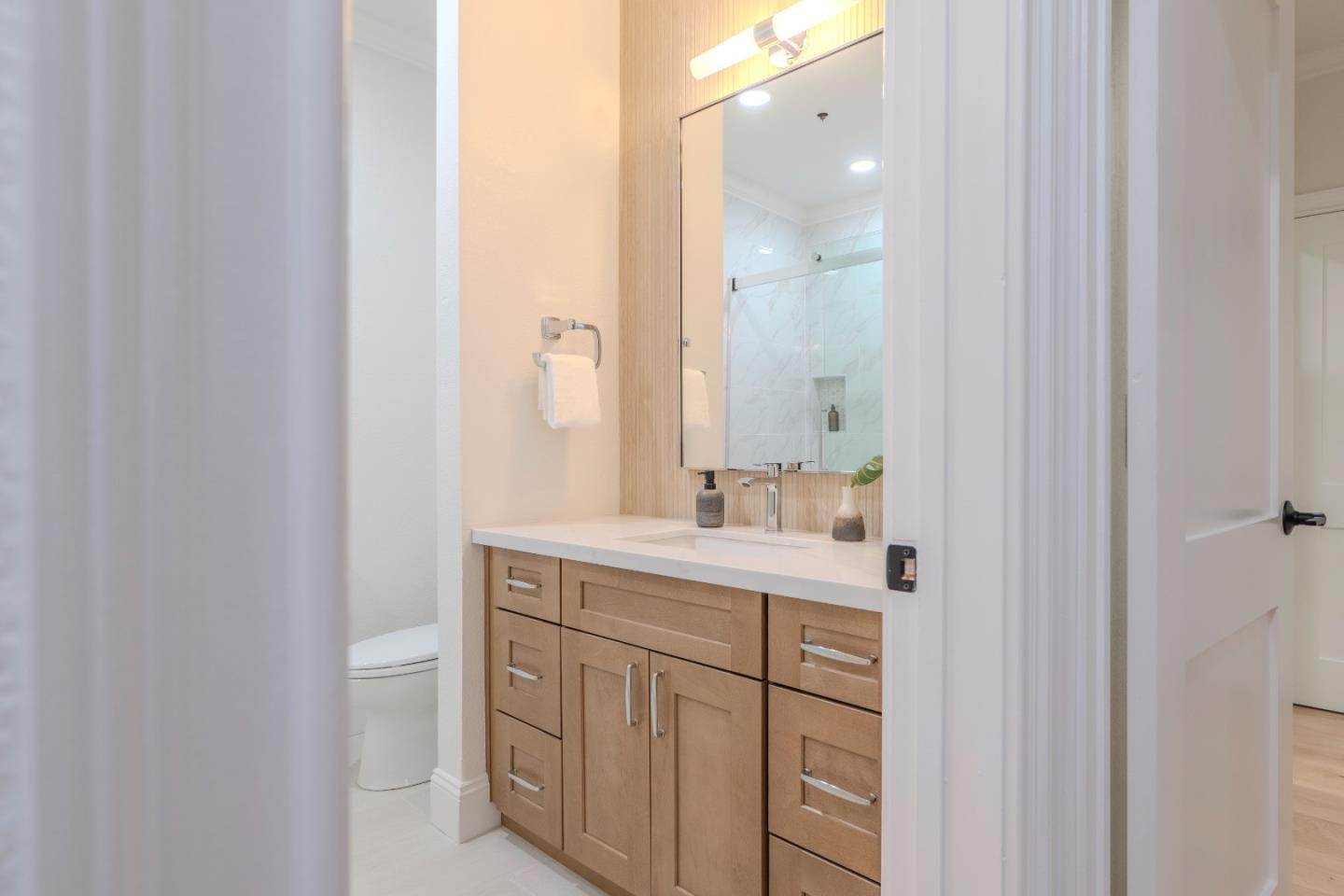 22330 Homestead Road, Unit 116 Cupertino, CA 95014 - Photo 25 of 30 a bathroom with a sink and a mirror