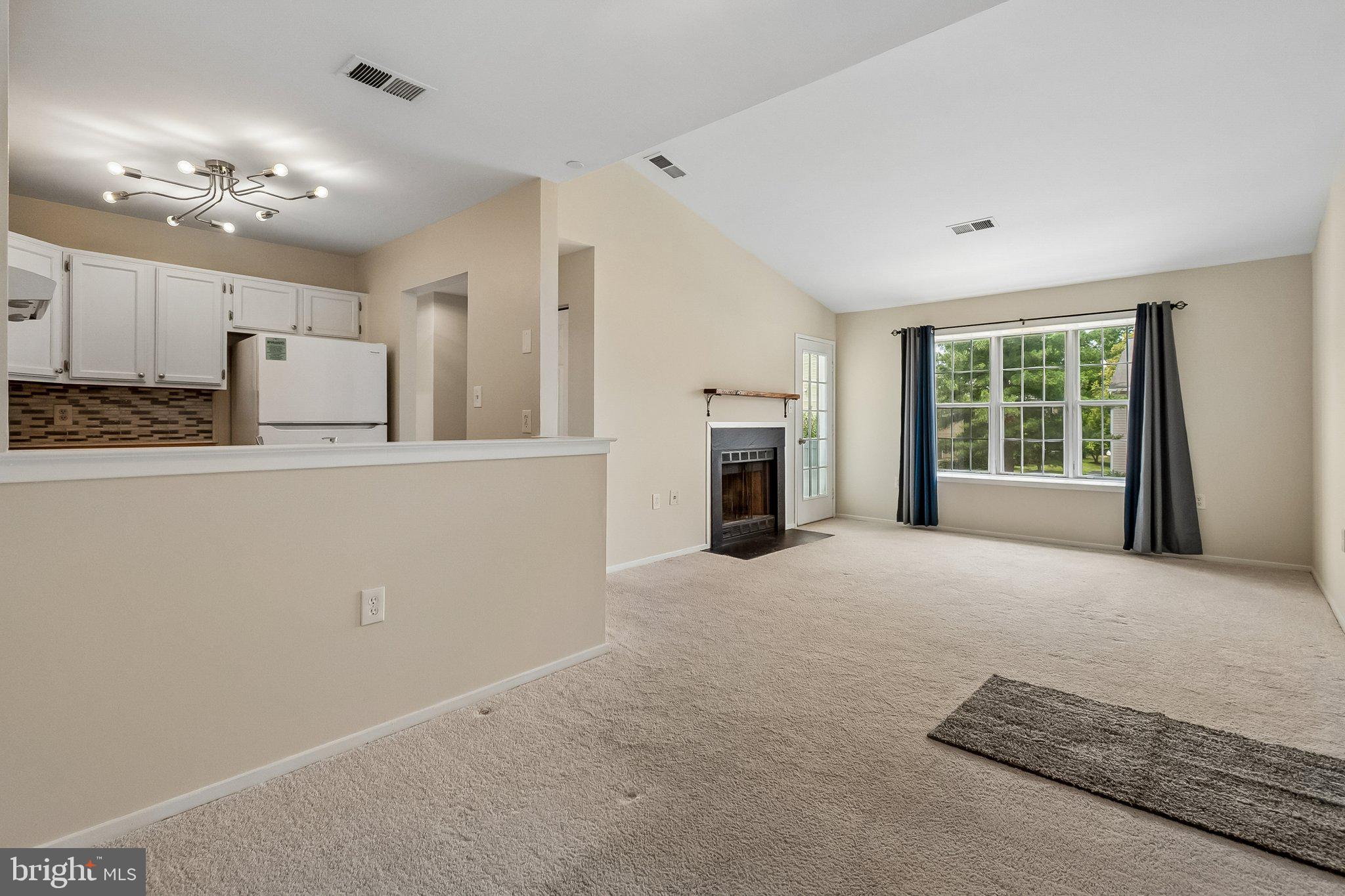 7822 Harrowgate Circle, Unit D Springfield, VA 22152 - Photo 7 of 28 View dining room into living room
