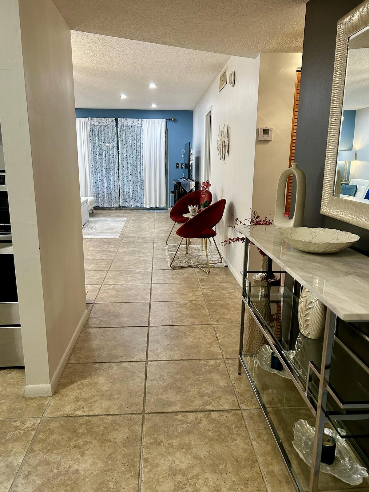 Undisclosed Address Delray Beach, FL 33445 - Photo 1 of 23 a view of a room with furniture and wooden floor