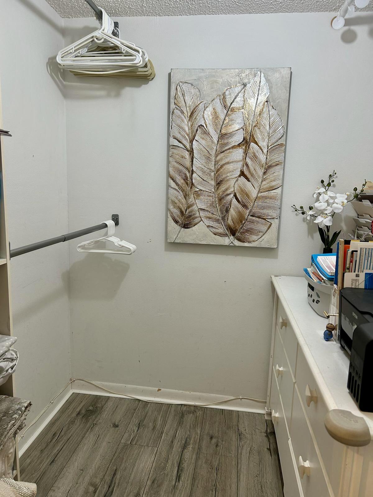 Undisclosed Address Delray Beach, FL 33445 - Photo 15 of 23 a view of a bathroom with a sink and wooden floor