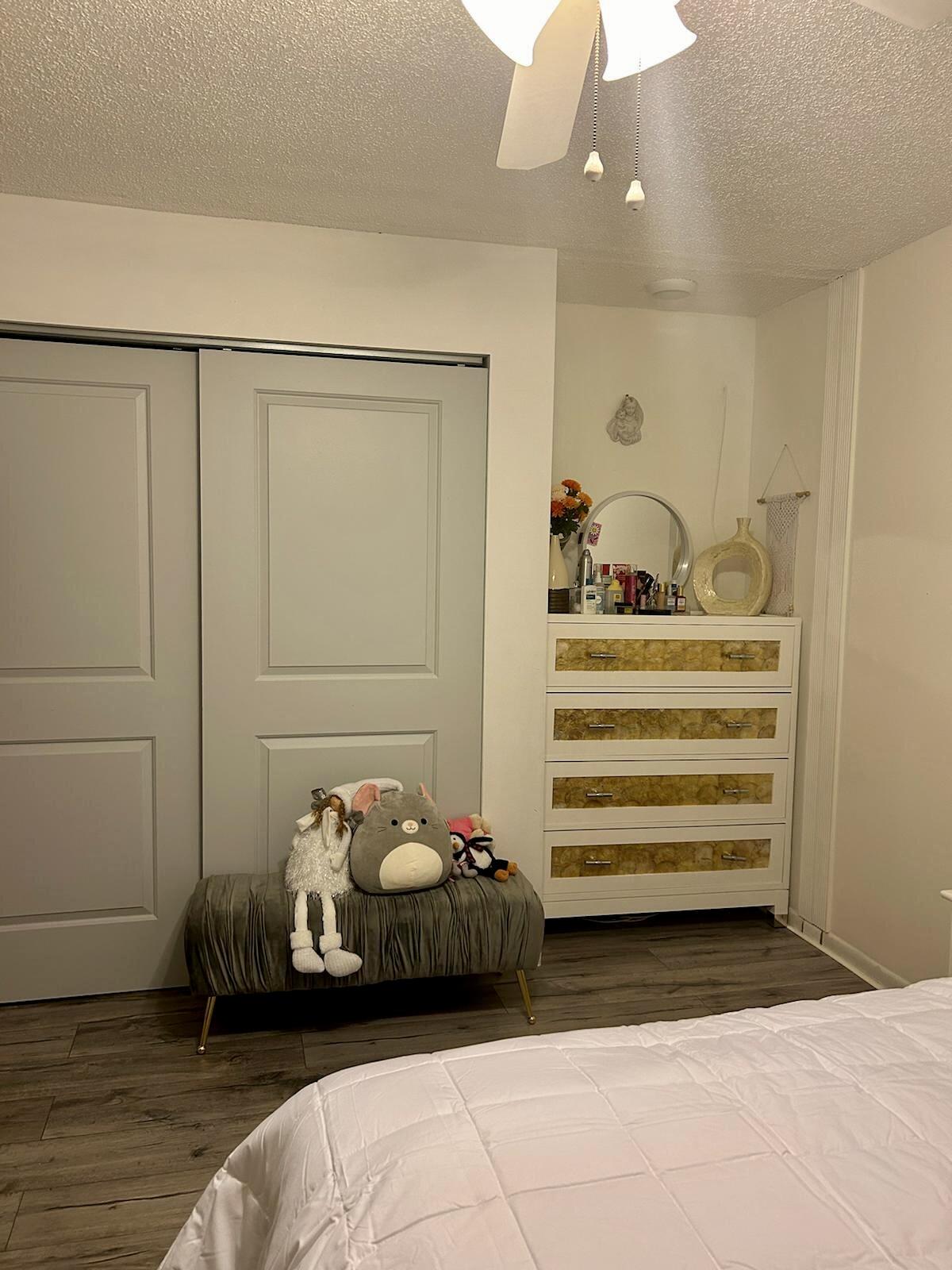 Undisclosed Address Delray Beach, FL 33445 - Photo 19 of 23 a bedroom with a bed and a cabinets