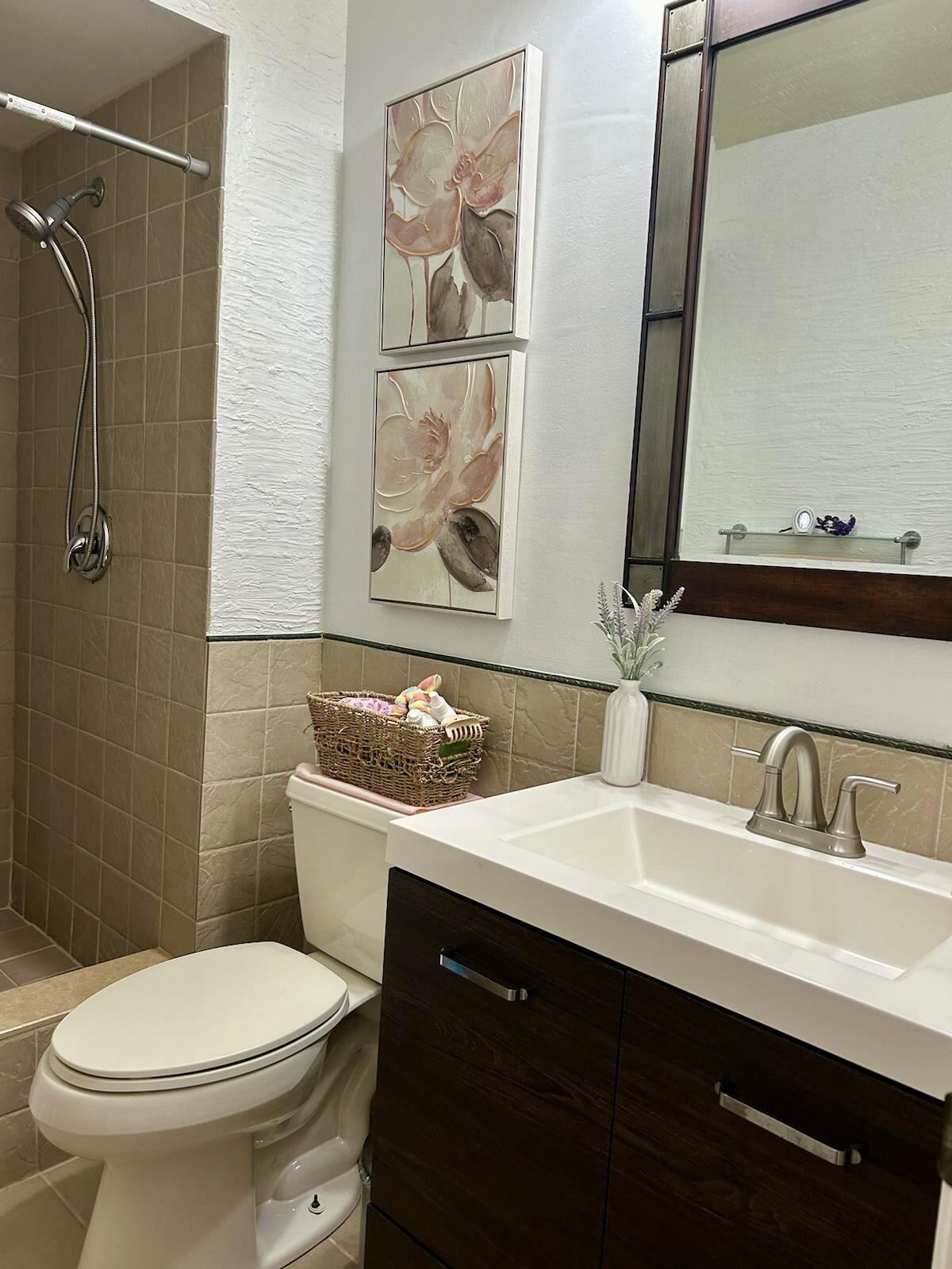 Undisclosed Address Delray Beach, FL 33445 - Photo 20 of 23 a bathroom with a sink and a toilet