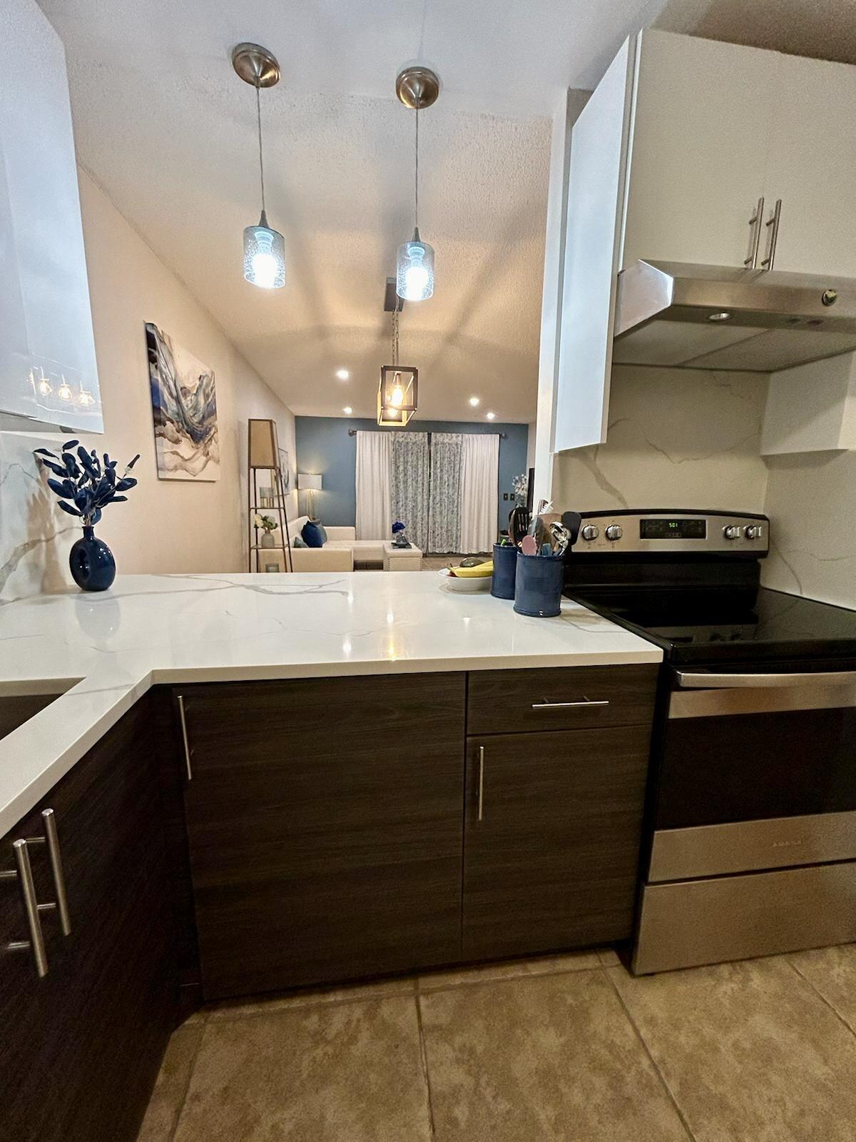 Undisclosed Address Delray Beach, FL 33445 - Photo 3 of 23 a kitchen with a sink and cabinets