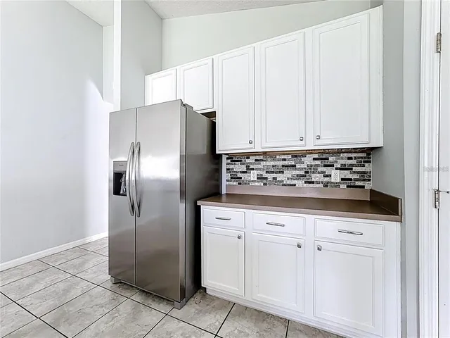 a kitchen with stainless steel appliances a stove a sink and a refrigerator