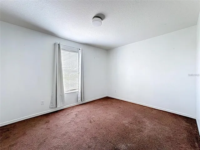 a bathroom with a bathtub and a toilet