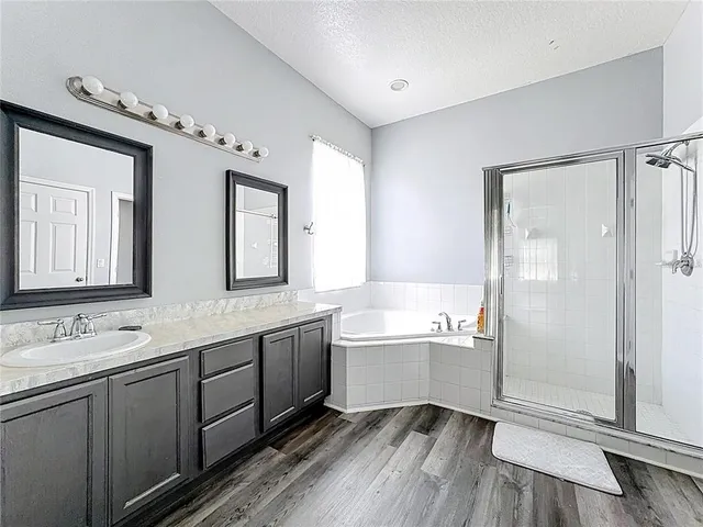 a kitchen with stainless steel appliances a stove a sink and a microwave