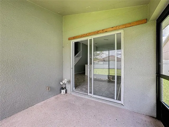 an aerial view of a pool a yard patio swimming pool and outdoor seating