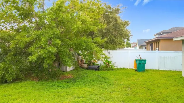 a backyard of a house with yard and staircase