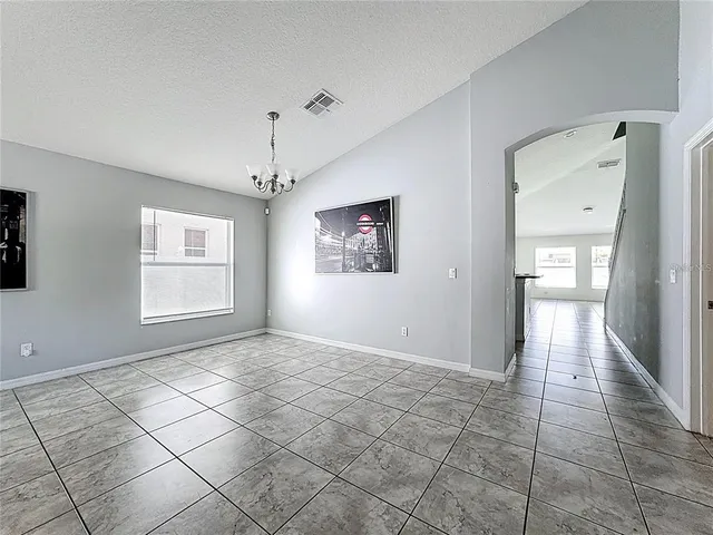 a view of a big room with windows and cabinet